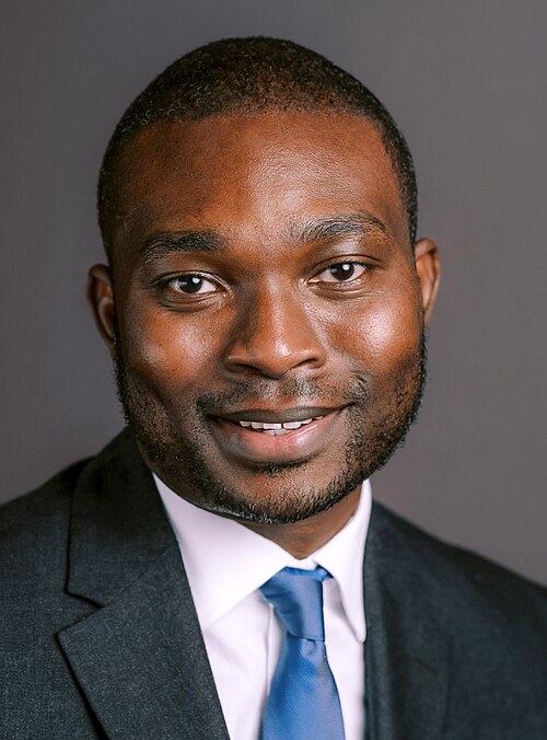 Official portrait of Solomon Adesanya